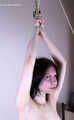 Tracy: topless barefoot girl with noose on her neck, having her to stand on her tip toes to breathe, is tickled by camera man