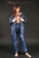 Alina posing in a studio wearing a supersexy blue rainwear combination (Pics)