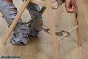 Hot jeans girl cuffed on a chair