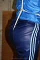 Alina tied and gagged in shiny nylon clothes