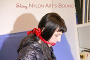 Mara ties and gagges herself with hand cuffs on a sofa wearing a supersexy black Leggings and a shiny nylon shorts and a rain jacket (Pics)