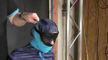 Marie bound and gagged in shiny nylon Rainwear