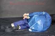Lucy tied with cuffs overhead and gagged with a clothgag wearing sexy blue rain pants and a raincoat (Pics)
