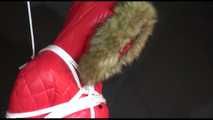 ***SEXY MARA*** wearing a supersexy black shiny nylon pants and a red shiny nylon down jacket with a coat being bound overhead with ropes and a ball gag (Video)