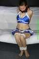 Sandra bound and gagged wearing a shiny wetlook Cheerleader Dress