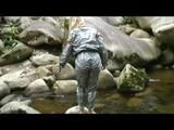 Sophie enjoying the water and weather on a river wearing supersexy grey sauna pvc rainwear (Video)