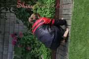 Watching sexy Sandra wearing a oldschool black/red shiny nylon rainwear combination while gardening outside (Pics)