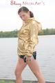 Enni having a good time outdoor wearing sexy shiny nylon shorts and a top posing for the camera (Pics)