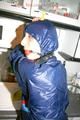 Stella tied, gagged and hooded in the kitchen wearing supersexy blue rainwear (Pics)