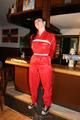 Jill bound in a red nylon rainsuit