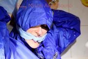 Sonja ties, gagges and hoodes herself in a bath tub wearing supersexy shiny nylon rainwear (Pics)