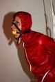 Alina tied and gagged in shiny nylon shorts and a shiny nylon cagoule