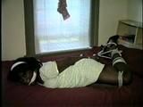 26 YR OLD BLACK BANK TELLER IS HOG-TIED, CLEAVE GAGGED AND HANDGAGGED WHILE STRUGGLING ON THE BED (D52-12)