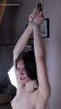 Tracy: topless barefoot girl with noose on her neck, having her to stand on her tip toes to breathe, is tickled by camera man