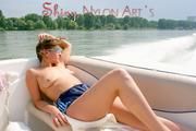Stella and Leonie on a boat wearing sexy shiny nylon shorts and bikini tops (Pics)