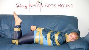 Leoni tied, gagged and hooded with tape wearing a sexy blue rainwear combination (Pics)