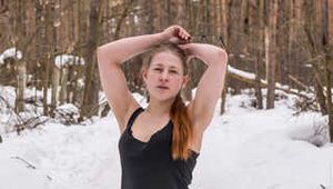 Katrin barefoot in the snow.