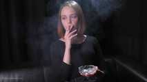 Dasha is smoking in the studio