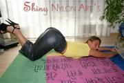 Stella posing in a living room wearing supersexy rainwear (Pics)
