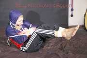 SANDRA tied, gagged and hooded with ropes on a bed wearing a supersexy oldschool rain jacket and a shiny nylon rain pants (Pics)