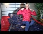 Sonja posing and lolling on bed wearing a sexy blue/red rainwear combination (Video)