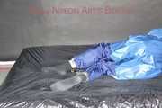 Lucy tied with cuffs overhead and gagged with a clothgag wearing sexy blue rain pants and a raincoat (Pics)