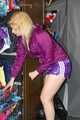 Pia enjoying a cupboard full of shiny nylon clothes trying on purple shiny nylon shorts and rain jacket (Pics)