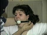 BALL-GAGGED, & TIED BETWEEN  2 PILLARS DAMSEL (D16-12)