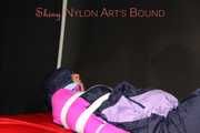 Watching Pia wearing blue/pink shiny nylon rainwear being tied and gagged and hooded with tape and a clothgag (Pics)
