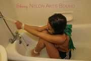 Stella tied and gagged with ropes and a cloth gag in a bath tub wearing ONLY a sexy black shiny nylon shorts (Pics)