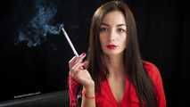 Gorgeous maneater Marina is smoking a 120mm with a short cigarette holder