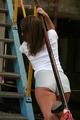 Stella posing outdoor on a stairway wearing sexy shiny nylon shorts (Pics)