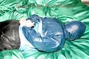Jill tied, gagged and double hooded on a bed wearing supersexy oldschool rainwear (Pics)