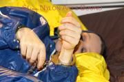 Lucy ties, gagges and hoodes herself on a bed wearing a sexy AGU rainnwear combination (Pics)