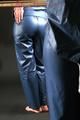 Alina posing in a studio wearing a supersexy blue rainwear combination (Pics)
