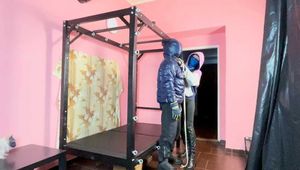 Breathplay Sebastien tied to an iron structure.