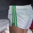 Sandra preparing her shiny nylon bed wearing sexy shiny nylon shorts and a top (Video)