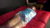 Watching sexy Pia being envelopped in film wearing a sexy blue shiny nylon shorts and a lightblue shiny nylon rainjacket (Video)