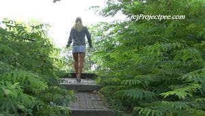 080003 Nikki Pees From A Bench