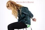 Samantha bound and gagged in a green shiny nylon shorts with green rain jacket and lycra leggings