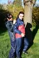 Jill and her friend in the garden playing with eachother wearing sexy shiny nylon rainwear (Pics)