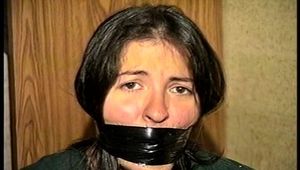 FIRST GRADE LATINA SCHOOL TEACHER IS WRAP GAGGED WITH SEMI CLEAR BROWN PACKAGING TAPE, BLACK ELECTRICAL TAPE, SILVER DUCT TAPE & MOUTH STUFFED WITH RAG (D69-4)