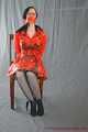 Bound in PVC minidress and red raincoat