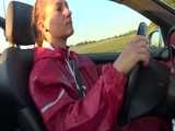 Watch Sandra taking a Walk during very hot Weather enjoying her rubberized oldschool Rainsuit