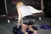 Watching Pia preparing her bed wearing a sexy black shiny nylon shorts and a grey tshirt (Pics)