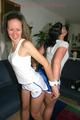 Jill and Petra tied and gagged to eachother in a living room both wearing sexy shiny nylon shorts and a top (Pics)