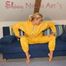 Sexy blonde archive girl posing and lolling on a sofa wearing sexy yellow rainwear over nothing (Pics)