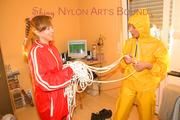 Stella tied, gagged and hooded from Leonie both wearing shiny nylon rainwear (Pics)