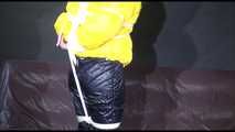 MARA tied and gagged overhead with ropes and a ballgag wearing a super sexy super shiny black rain pants, rubber boots and a yellow down jacket (Video)