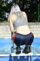 Watch Chloe enjoying summer in the Garden wearing her shiny nylon shorts